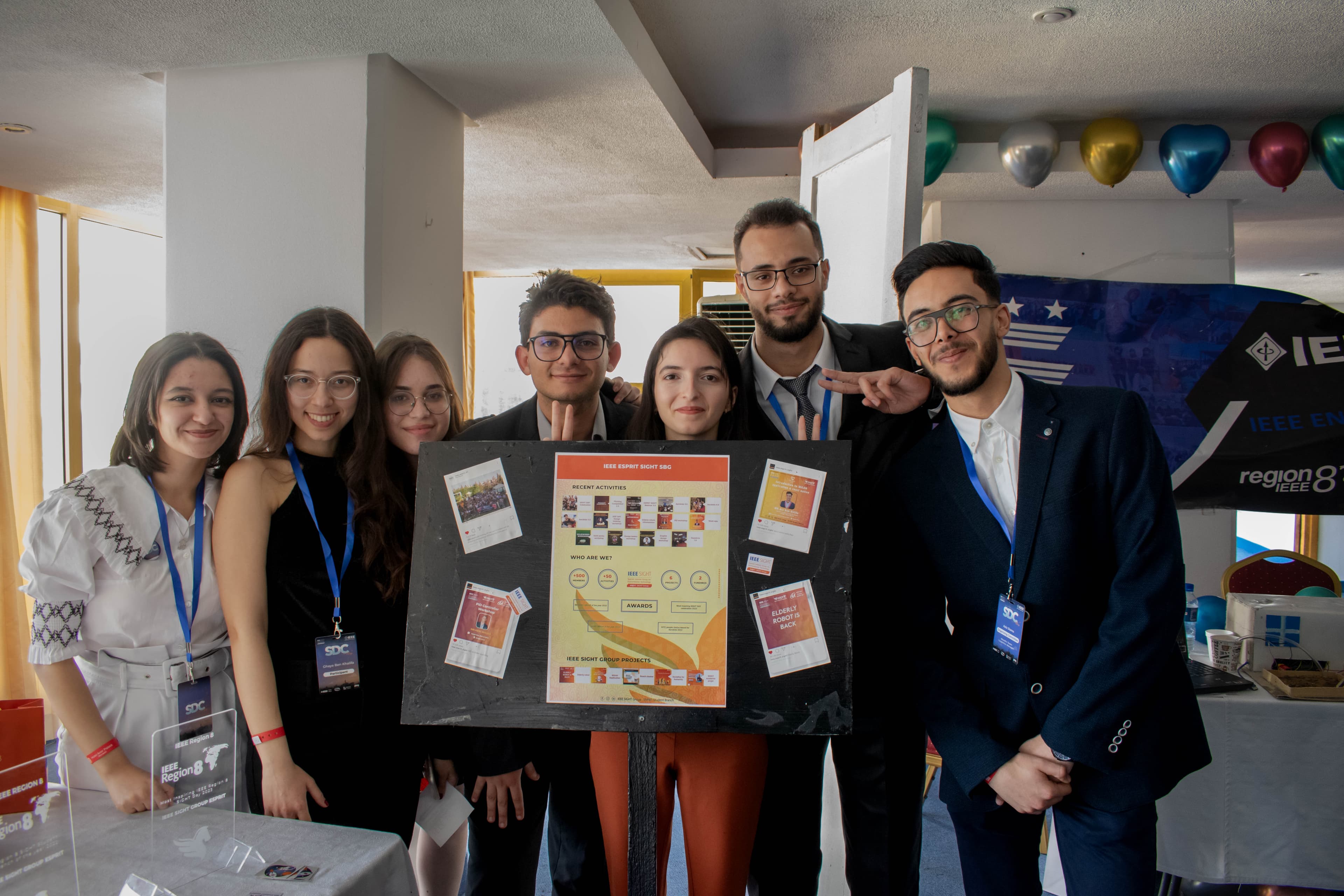 Group photo with presentation